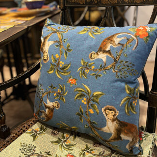 Blue monkey cushion on chair