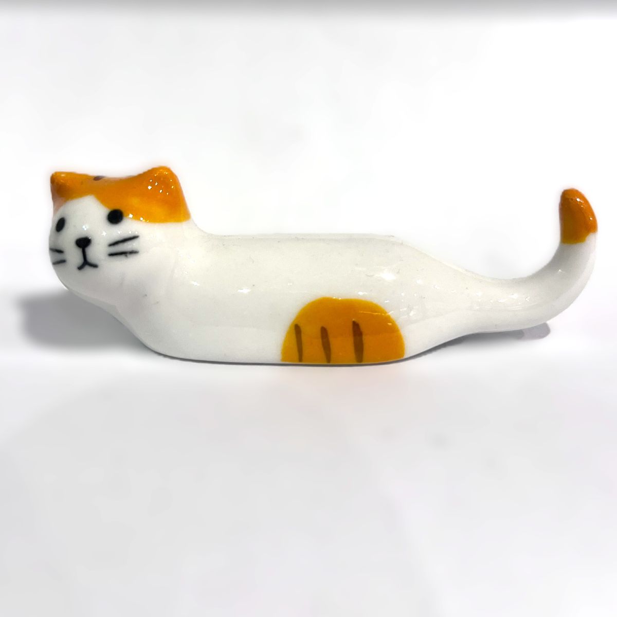 Soporte cerámico decorativo – Gato largo blanco y naranja 3€